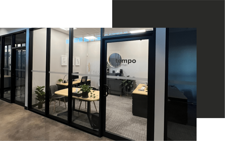 a glass wall with a sign that says tempo digital.