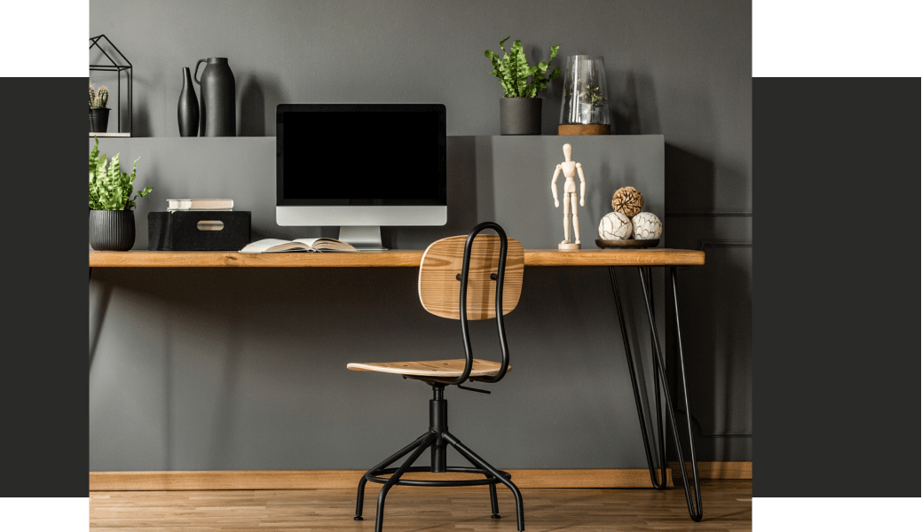 a laptop computer sitting on top of a desk.