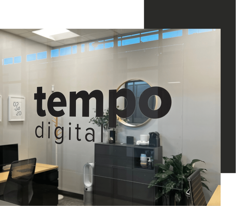 a glass wall with a sign that says tempo digital.